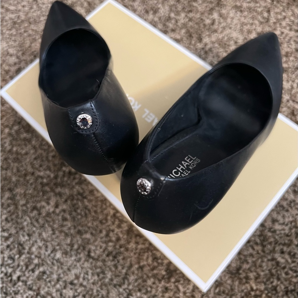 Gorgeous MK authentic black heels worn once.  They are just .5 a size too small